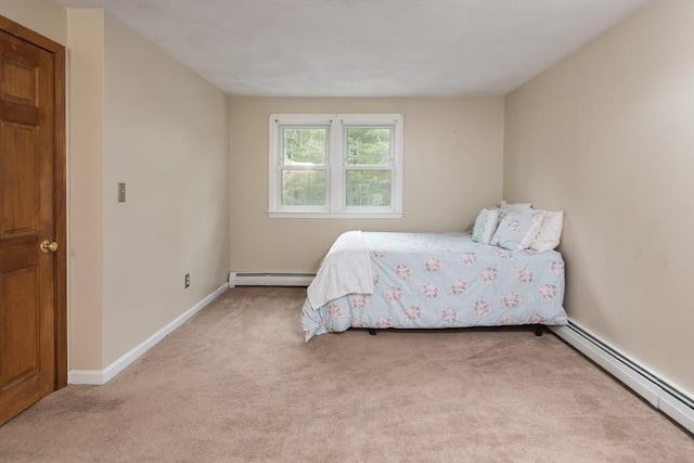 carpeted bedroom with baseboards and baseboard heating