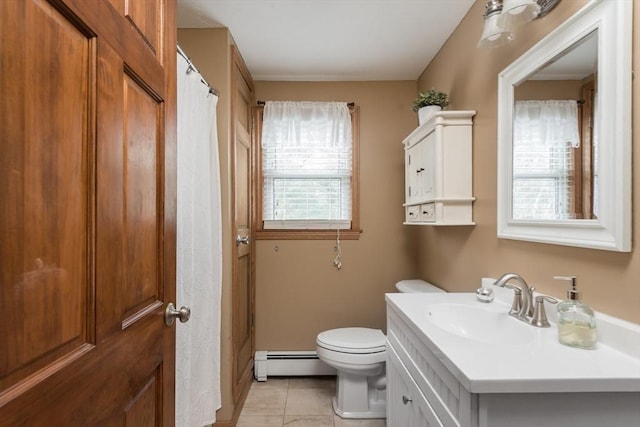 bathroom featuring vanity, toilet, tile patterned flooring, and a baseboard radiator