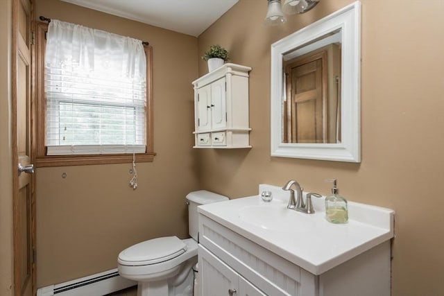 bathroom featuring toilet, vanity, and a baseboard radiator