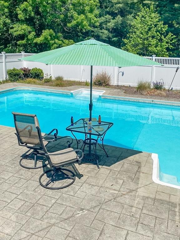 view of pool featuring a patio area, a fenced in pool, and a fenced backyard