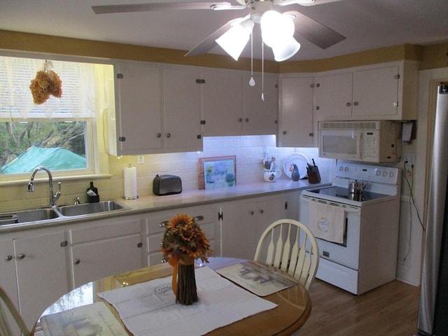 360 Russells Mills Rd, Dartmouth, MA 02748 - kitchen with white appliances, a sink, ceiling fan, white cabinetry, and tasteful backsplash