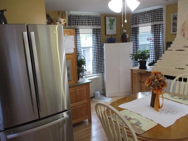 360 Russells Mills Rd, Dartmouth, MA 02748 - dining space featuring radiator heating unit, a ceiling fan, and light wood-style flooring