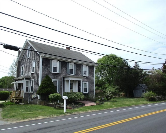 360 Russells Mills Rd, Dartmouth, MA 02748 - colonial-style house featuring a front lawn, a chimney, and roof with shingles