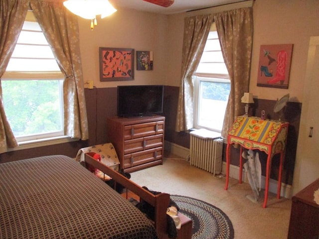 360 Russells Mills Rd, Dartmouth, MA 02748 - carpeted bedroom with radiator heating unit and multiple windows