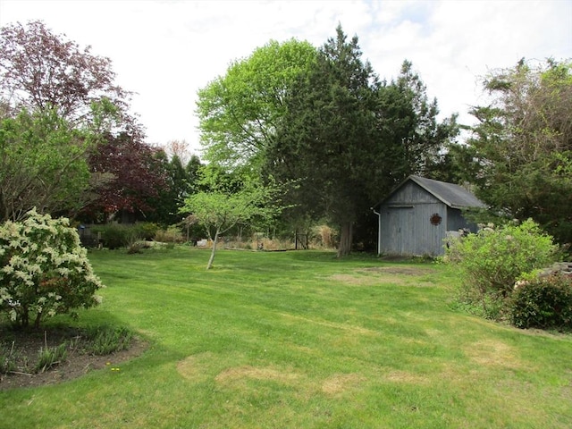 360 Russells Mills Rd, Dartmouth, MA 02748 - view of grassy yard featuring an outbuilding and a shed