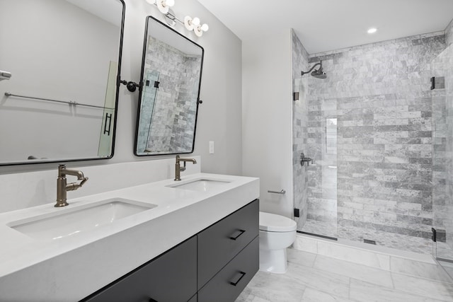 bathroom with walk in shower, vanity, and toilet