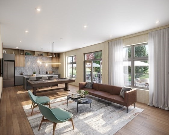 living room with light hardwood / wood-style flooring and a wealth of natural light