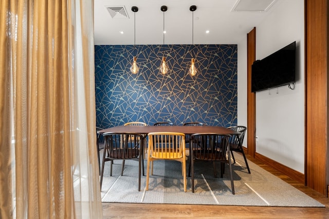 dining area with hardwood / wood-style flooring