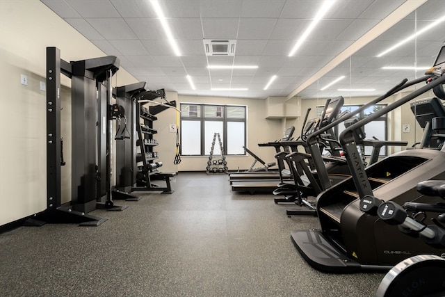 gym featuring a paneled ceiling