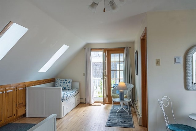 99 N Shore Blvd Unit 1, Sandwich, MA 02537 - bedroom with a skylight, access to exterior, lofted ceiling, and light wood-style floors