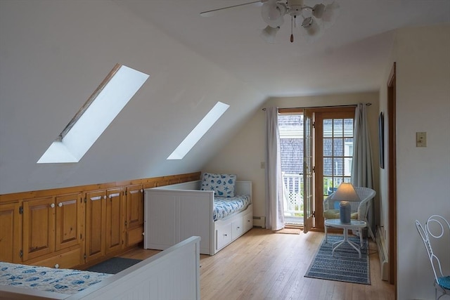 99 N Shore Blvd Unit 1, Sandwich, MA 02537 - bedroom featuring a skylight, access to exterior, lofted ceiling, light wood-type flooring, and ceiling fan