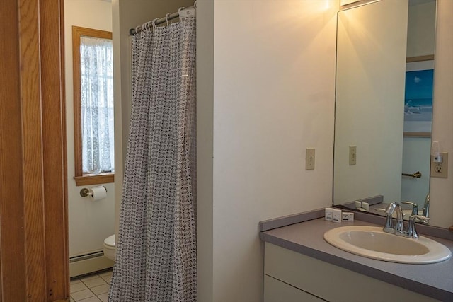 99 N Shore Blvd Unit 1, Sandwich, MA 02537 - bathroom featuring a baseboard heating unit, vanity, tile patterned flooring, and curtained shower