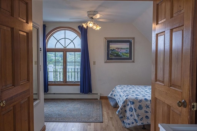99 N Shore Blvd Unit 1, Sandwich, MA 02537 - bedroom featuring light wood-style flooring, a baseboard heating unit, and a ceiling fan