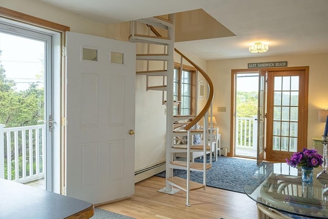 99 N Shore Blvd Unit 1, Sandwich, MA 02537 - foyer entrance with stairway, a baseboard heating unit, and wood finished floors