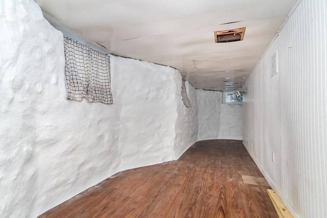 basement featuring wood-type flooring