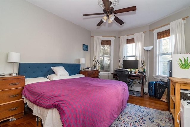 bedroom featuring hardwood / wood-style flooring and ceiling fan