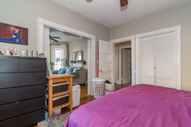 bedroom featuring hardwood / wood-style floors, a closet, and ceiling fan