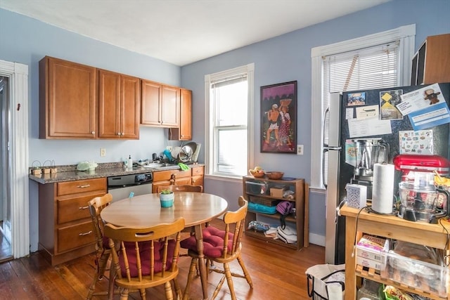 kitchen with plenty of natural light and dark hardwood / wood-style flooring