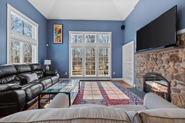 33 Gulf Hill Dr, Dartmouth, MA 02748 - living area featuring baseboards, vaulted ceiling, wood finished floors, and a fireplace