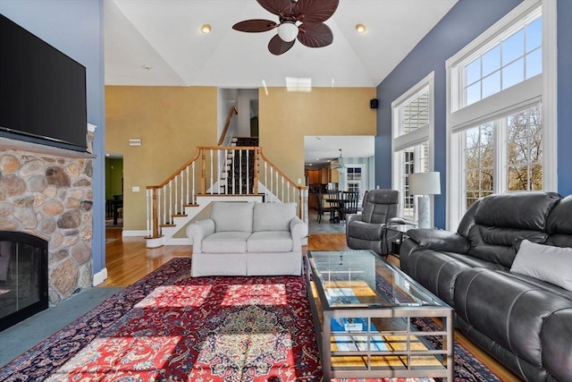 33 Gulf Hill Dr, Dartmouth, MA 02748 - living room featuring stairway, ceiling fan, wood finished floors, and high vaulted ceiling