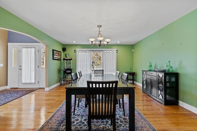 33 Gulf Hill Dr, Dartmouth, MA 02748 - dining area with arched walkways, an inviting chandelier, light wood-style flooring, baseboards, and recessed lighting