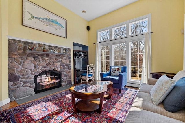 33 Gulf Hill Dr, Dartmouth, MA 02748 - living area featuring a towering ceiling, wood finished floors, and a stone fireplace