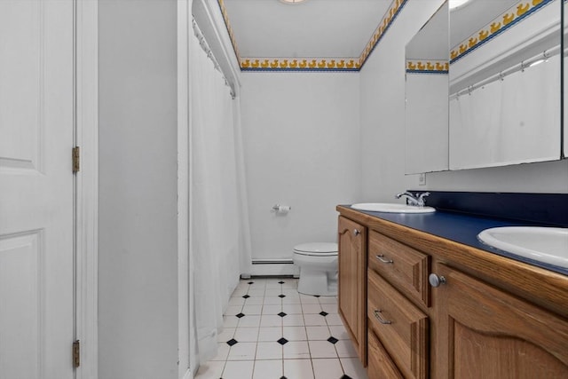 33 Gulf Hill Dr, Dartmouth, MA 02748 - full bath with baseboard heating, a sink, double vanity, toilet, and tile patterned flooring