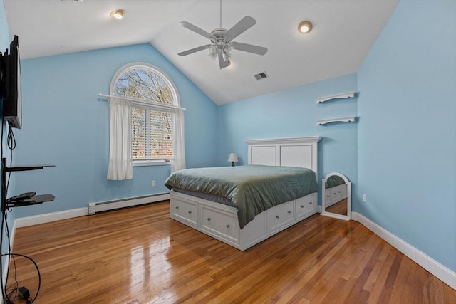 33 Gulf Hill Dr, Dartmouth, MA 02748 - bedroom featuring lofted ceiling, wood finished floors, visible vents, a ceiling fan, and a baseboard radiator