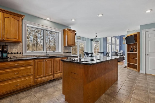 33 Gulf Hill Dr, Dartmouth, MA 02748 - kitchen featuring a wealth of natural light, black electric cooktop, a sink, and a kitchen island