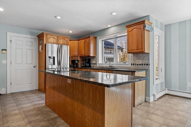 33 Gulf Hill Dr, Dartmouth, MA 02748 - kitchen featuring a sink, stainless steel fridge, backsplash, stovetop, and a kitchen island