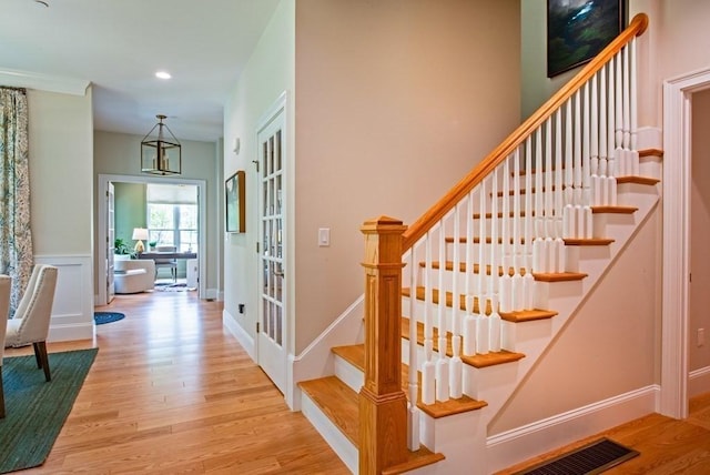 staircase featuring hardwood / wood-style floors