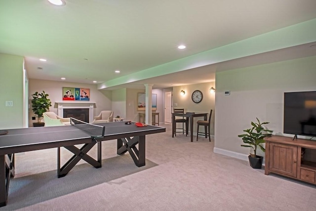 recreation room with light colored carpet