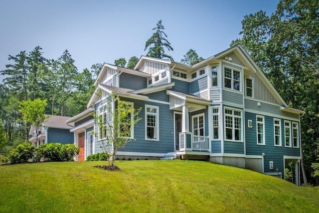 rear view of house with a yard