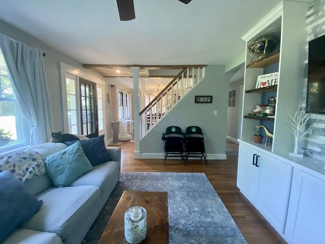 551 Indian Head St, Hanson, MA 02341 - living area with ceiling fan, stairway, dark wood finished floors, and ornate columns