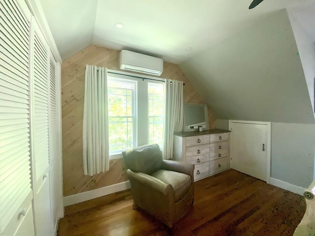 551 Indian Head St, Hanson, MA 02341 - sitting room featuring a wall unit AC, lofted ceiling, wood walls, and wood finished floors