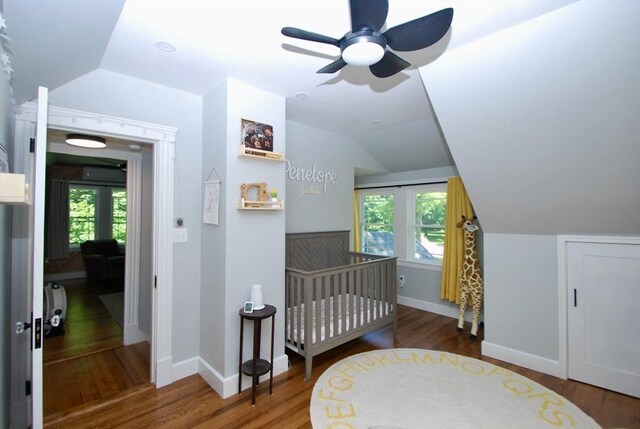 551 Indian Head St, Hanson, MA 02341 - bedroom with lofted ceiling, multiple windows, wood finished floors, a ceiling fan, and a nursery area