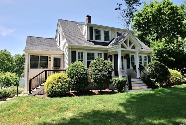 551 Indian Head St, Hanson, MA 02341 - bungalow-style house with a front yard, a chimney, stairs, and roof with shingles