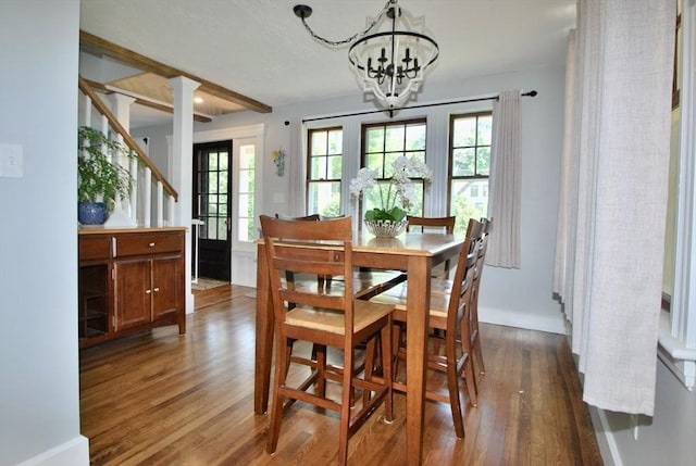551 Indian Head St, Hanson, MA 02341 - dining room with dark wood-type flooring, a chandelier, stairway, and beam ceiling