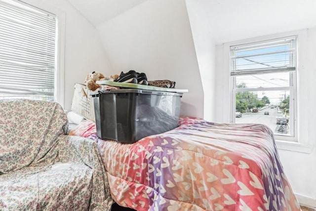 831 N Shore Rd, Revere, MA 02151 - bedroom featuring vaulted ceiling and multiple windows
