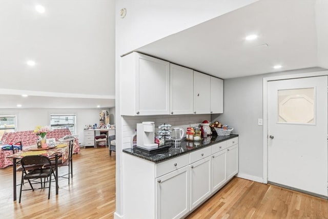 831 N Shore Rd, Revere, MA 02151 - kitchen with light wood-type flooring, white cabinetry, dark stone countertops, and recessed lighting