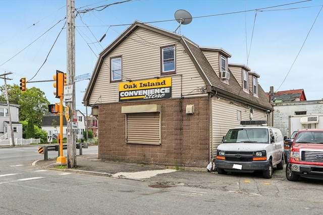 831 N Shore Rd, Revere, MA 02151 - view of front of house featuring a gambrel roof and roof with shingles