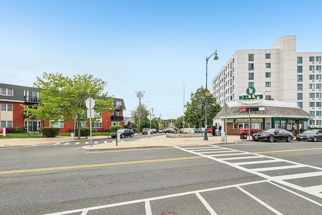 831 N Shore Rd, Revere, MA 02151 - view of asphalt street featuring traffic signs, sidewalks, street lighting, and curbs