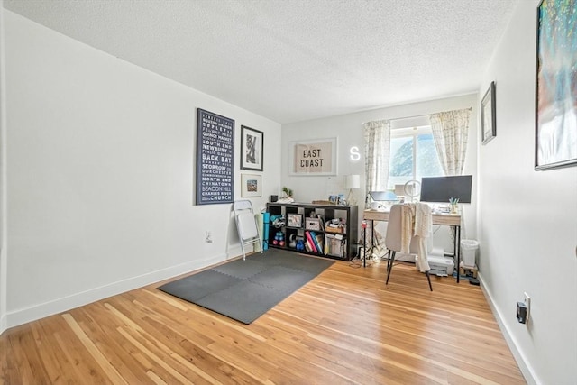 80 Main St Unit 20, Malden, MA 02148 - office area with a textured ceiling and wood finished floors