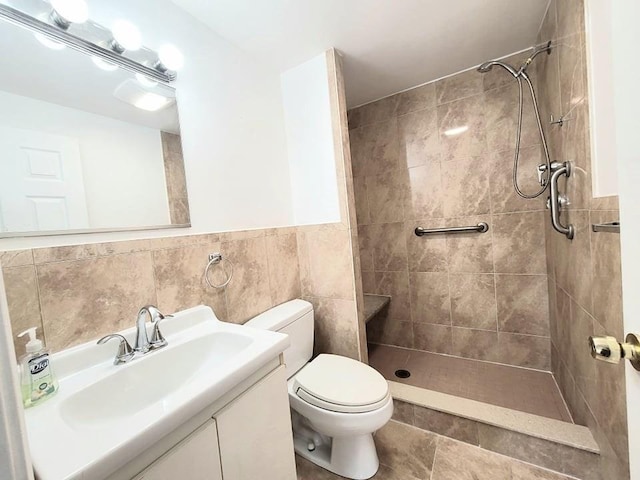 80 Main St Unit 20, Malden, MA 02148 - bathroom with a tile shower, vanity, and tile walls