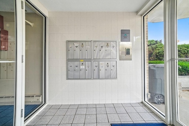 80 Main St Unit 20, Malden, MA 02148 - view of community featuring tile walls and mail area