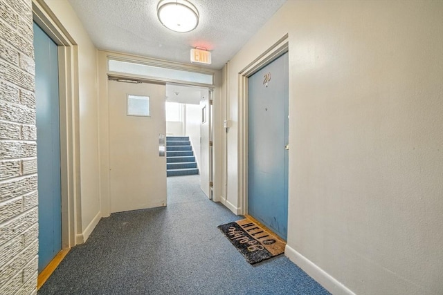 80 Main St Unit 20, Malden, MA 02148 - hall with a textured ceiling and stairway