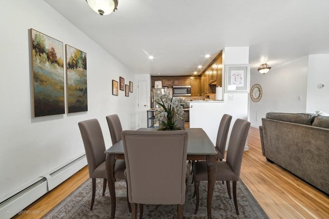 80 Main St Unit 20, Malden, MA 02148 - dining space featuring a baseboard radiator, light wood-type flooring, and recessed lighting