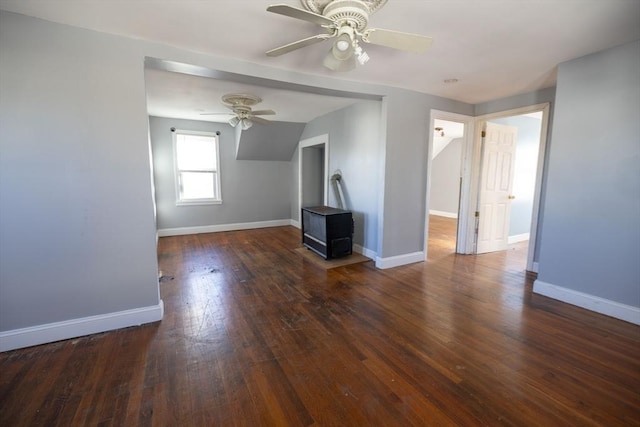 unfurnished living room featuring ceiling fan, dark hardwood / wood-style flooring, and lofted ceiling