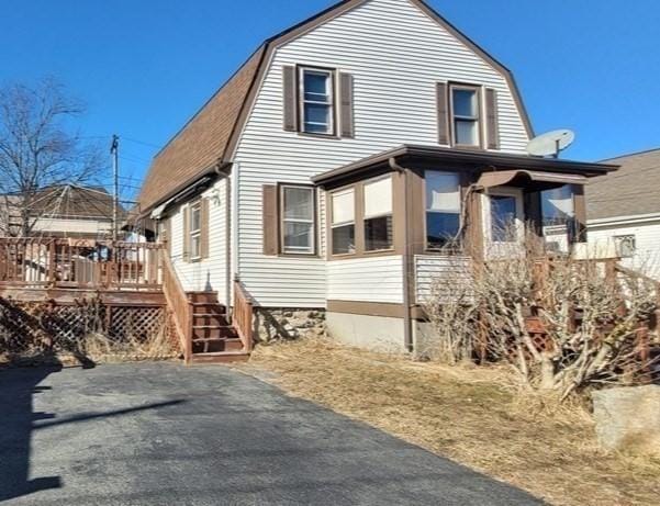 view of side of property featuring a deck