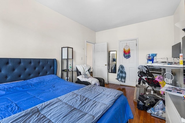 bedroom with wood finished floors